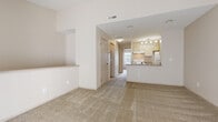 Located at 3419 Heritage Glen Dr in Grove City, Ohio, this one-bedroom, one-bathroom residence offers a well-organized and efficiently designed floor plan. The combined kitchen and living room serves as the heart of the home, featuring an open-concept layout with a peninsula countertop that separates the kitchen from the living area. The kitchen is equipped with white cabinetry, a white electric range, a refrigerator, a built-in sink, and track lighting overhead that provides bright, focused illumination. Neutral-toned carpet flows throughout the living areas, complementing the warm, light-colored walls. The living room benefits from a sliding glass door and an additional window, allowing generous natural light and outdoor views to fill the space. The bedroom offers a comfortable footprint with two windows that frame exterior greenery, plush carpeting, and a dedicated closet for storage. The full bathroom features tile flooring in an earthy tone, a single-sink vanity with a laminate countertop, a full-size soaking tub with a shower, and a mirror above the vanity. Connecting hallways provide a logical flow between rooms, completing this clean and functional layout.