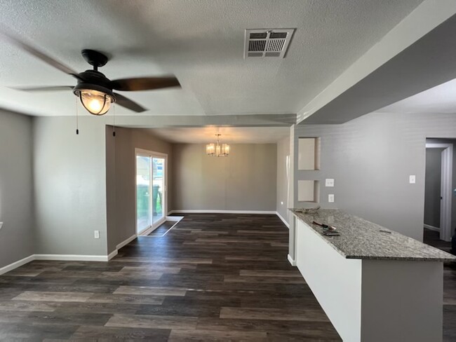 View of Living Room, Dining Room, and Kitchen - 828 Horseshoe Dr