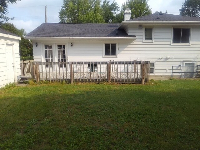 Back of home with wooden deck Looking North - 1528 Linden St