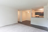 Located at 5781 Lake Edward Dr in Virginia Beach, Virginia, this single-floor residence offers a well-organized layout with a variety of comfortable living spaces. The open-concept living area features plush carpeting and transitions seamlessly to the kitchen through a half-wall pass-through, creating a connected and functional flow. A large sliding glass door floods the living room with natural light and provides access to the outdoors, complemented by vertical blinds for privacy.

The kitchen is appointed with rich, dark espresso cabinetry, granite-style countertops, dark wood-look flooring, and black appliances including an electric range with overhead ventilation. A dedicated dining area adjacent to the kitchen offers additional space for everyday living.

Multiple carpeted bedrooms provide comfortable retreats, each featuring neutral tones, textured ceilings, and ample closet space — including double sliding-door closets in at least one room. Windows in the bedrooms bring in natural light and offer views of the surrounding neighborhood and mature trees.

The bathrooms are finished with dark wood-look flooring and dark vanity cabinetry, each including a tub/shower combination and clean white fixtures. The overall design maintains a consistent, neutral palette throughout, offering a move-in ready environment in a convenient Virginia Beach location.