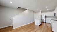 Located at 7600 Pennsy Pky, this two-story home offers three bedrooms, three bathrooms, and a thoughtfully designed layout spread across two floors. The main level hosts the kitchen, which is a standout feature of the home. It showcases white shaker-style cabinetry, stainless steel appliances including a refrigerator, range, and over-the-range microwave, light wood-look flooring, and a central island with a dual-basin sink — ideal for both cooking and casual dining.

The upper level is home to the bedrooms, each finished with soft, neutral carpet and ceiling fans. The generously sized primary bedroom includes a walk-in closet with built-in shelving. Additional bedrooms offer comfortable proportions, natural light through blinds-fitted windows, and views of the surrounding greenery. Each bedroom benefits from easy access to the hallway connecting the floor.

All three bathrooms maintain a clean, consistent aesthetic with light wood-look flooring, brushed nickel fixtures, and full tub-shower combinations with curved curtain rods. Grab bars are present, adding an accessibility-conscious touch. The overall design palette — neutral grays, white trim, and warm wood tones — creates a cohesive, move-in-ready atmosphere throughout the home.