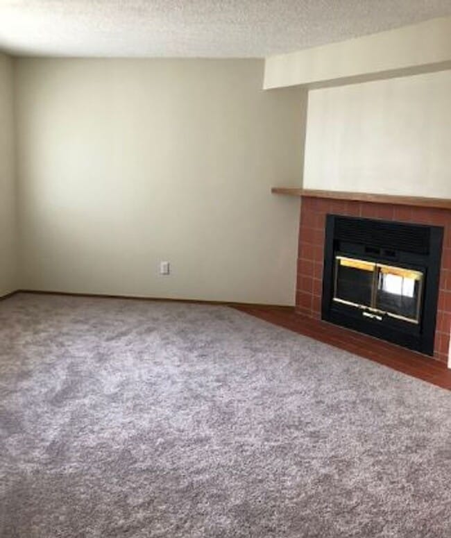 Photo - 2 BR/1BA | Newly Renovated Unit | Front Patio| Fireplace in living room! House