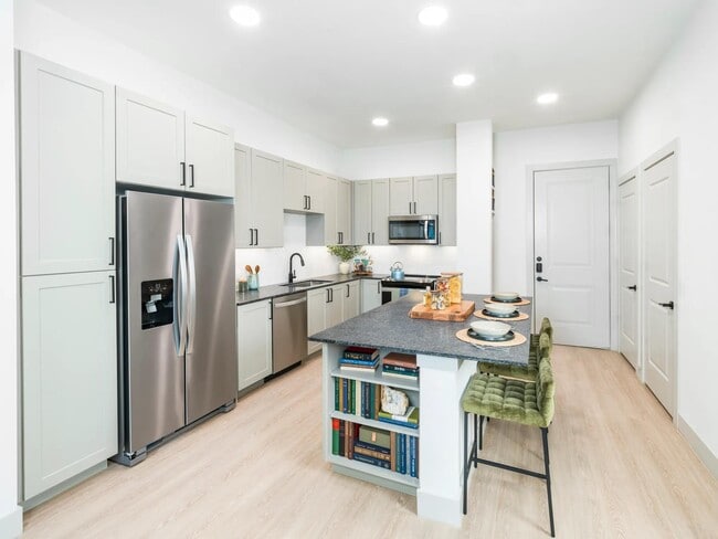 Breakfast bar with upgraded island overhangs* - Modera McKinney Ridge