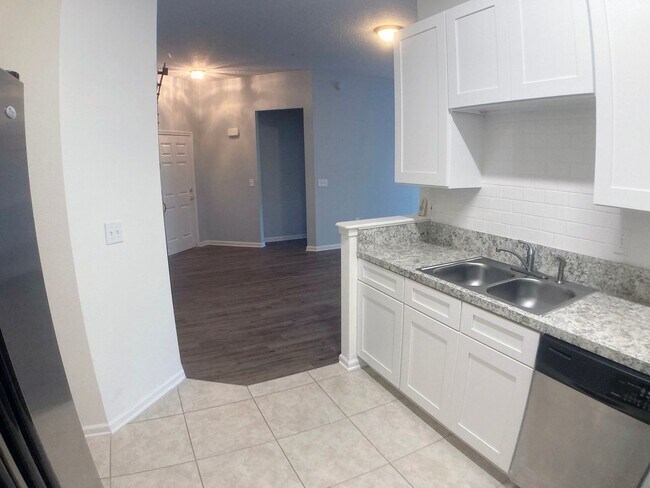 Building Photo - Spacious 3-Bedroom Condo with Pond Views &...