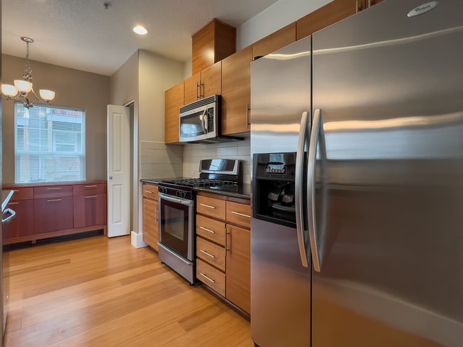 Building Photo - Enjoy this 3 Bedroom 2.5 Bathroom End Townhome ~ 2 Car Garage + Washer & Dryer! Great Cedar Mill ...