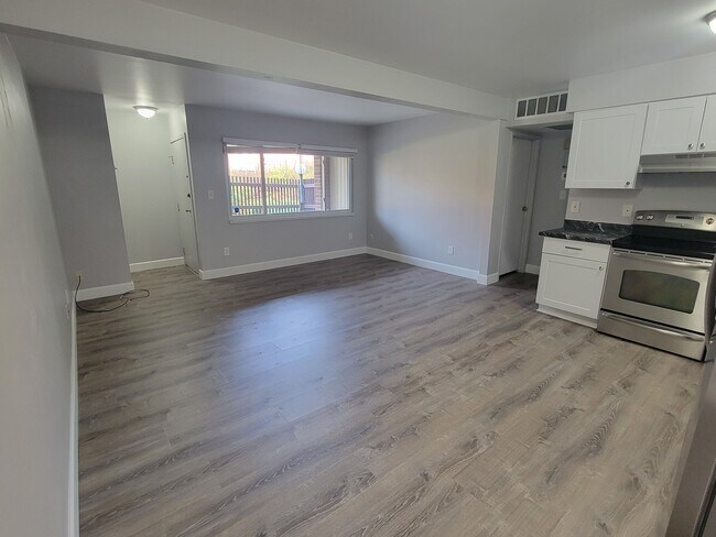 Living/Kitchen-brand new flooring and cabinets - 3663 S Sheridan Blvd Apartment