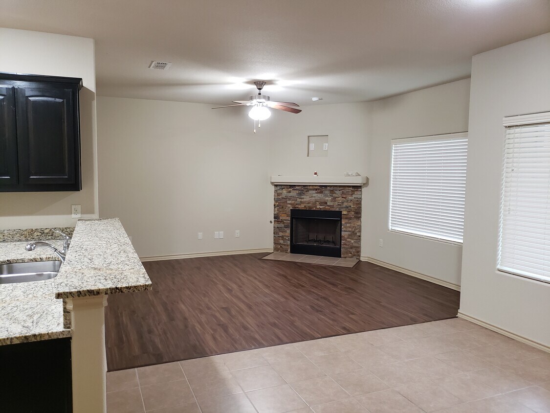 Den with stacked stone wood burning fire place. - 1808 Potrillo Ln