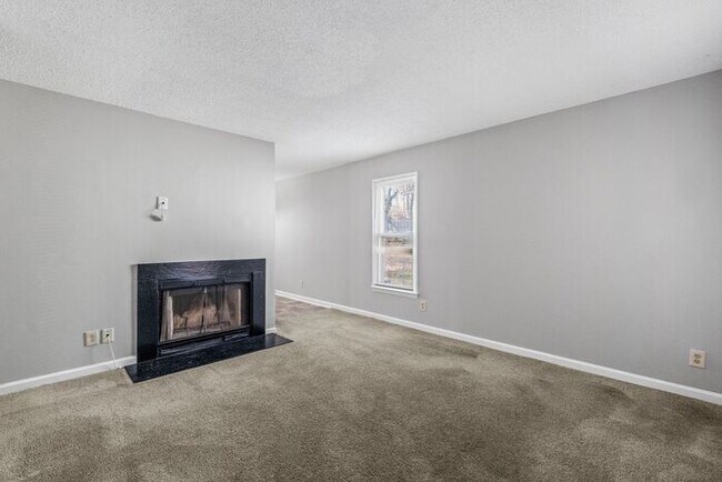 Building Photo - NE Home - Updated Kitchen and Bathrooms! SS Appliances, Fire Place, Front Porch & Deck, Fenced Yard!