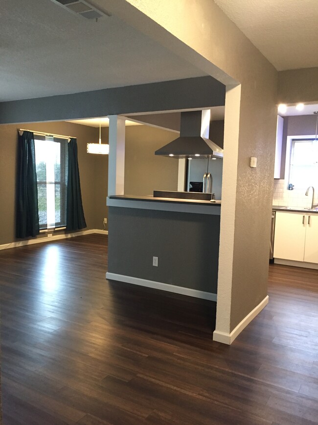 Unit has Luxury wood laminate throughout for easy cleaning. - 6563 Calmont Avenue