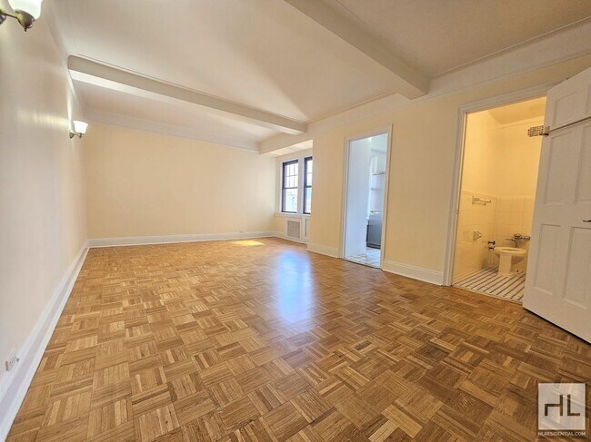 Building Photo - Sunlit 8th-Floor Studio with Two Large Closets in the West Village