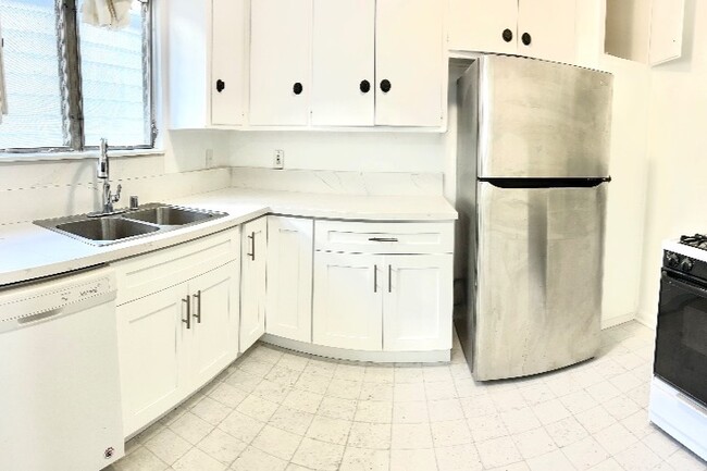 Ample counter space, storage and pantry in updated kitchen - 1234 S Westgate Ave Apartments