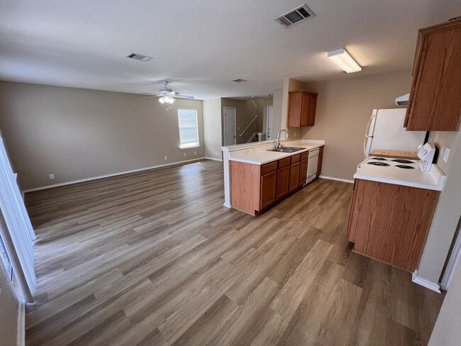 Building Photo - Generous Outdoor Space & Lawn Care Included!