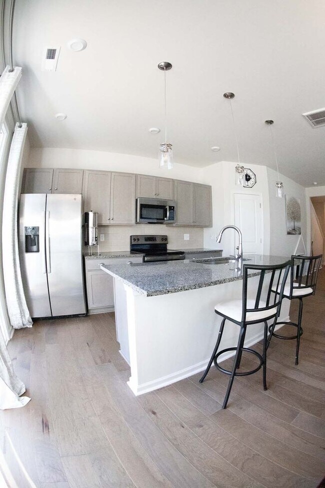 Building Photo - Introducing a one-year-old end unit townhome