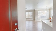 This well-appointed 3-bedroom, 2-bathroom single-floor home in Tulsa, Oklahoma offers a thoughtfully designed layout that balances comfort and functionality. The open-concept living, dining, and kitchen area serves as the heart of the home, featuring light wood-look flooring, crown molding, and an abundance of natural light streaming through multiple windows dressed with blinds. A tiled fireplace with a white mantel adds a focal point to the living room, creating a warm and inviting ambiance.

The kitchen is equipped with stainless steel appliances, including a refrigerator, range, microwave, and dishwasher, complemented by crisp white cabinetry and light quartz countertops. A dedicated pantry provides additional storage. The dining area is highlighted by a pendant light fixture and generous window views of the outdoors.

The spacious primary bedroom features plush carpet, elevated ceilings, and a double-door closet. Additional bedrooms are carpeted and include windows that bring in natural light. Five closets throughout the home ensure ample storage. Both bathrooms offer white vanities with quartz counters, tub-shower combinations, and wood-look flooring. The home also includes a laundry area, hallway, and an outdoor patio.