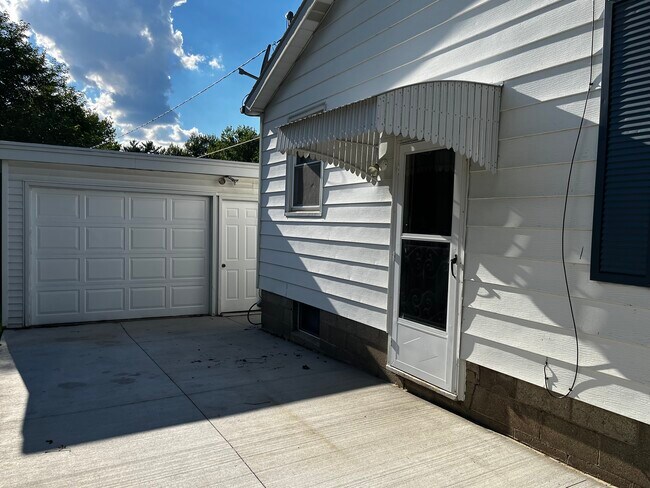 New driveway freshly painted garage door - 2045 Chaney Rd
