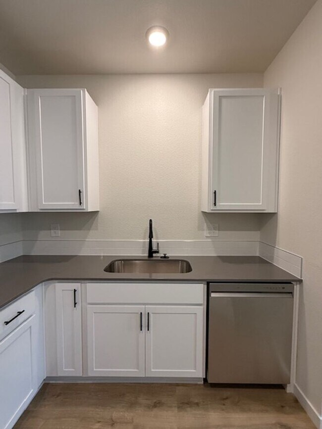 Building Photo - New 2 Bedroom Townhome + 2 Car Garage