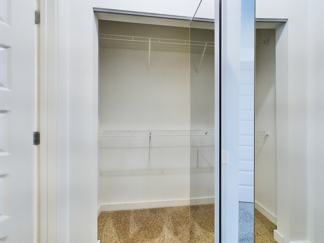 Closet Side 1 - Aurora St. Leon Apartments
