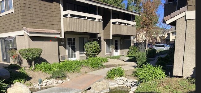 from ground looking up left at condominium upper left - 344 Streamwood
