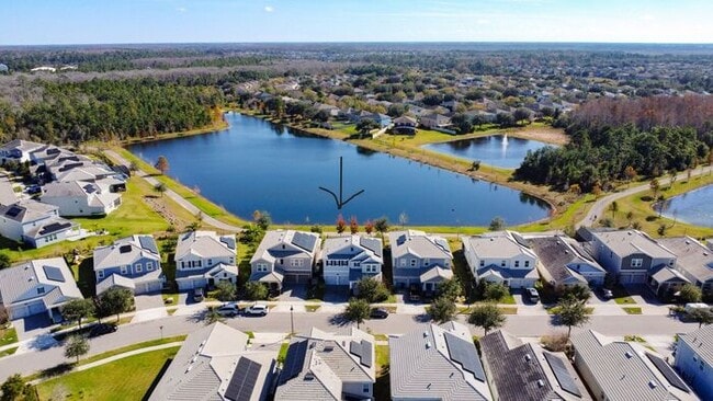 Building Photo - 4 Bedroom 2.5 bath LUXURY Lake Nona Storey Park Pool Home with Solar Panels and a Pond View!