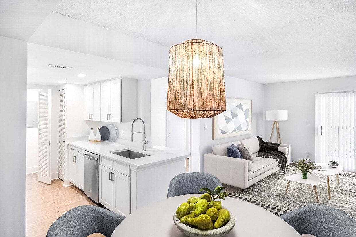 Discover newly renovated interiors in select homes, complete with brand new stainless-steel appliances, quartz countertops, modern cabinetry, and stylish vinyl plank flooring. - Windsor Coconut Creek