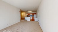 Located at 610 Towne Center Dr in Joppa, MD, this well-appointed single-floor residence offers three bedrooms, two bathrooms, and a thoughtfully designed layout that maximizes comfort and functionality. The open-concept living and kitchen area serves as the heart of the home, where warm wood-toned cabinetry, dark countertops, and a tile backsplash give the kitchen a classic, inviting character. A peninsula with a dark countertop and pendant lighting provides additional prep space and separates the kitchen from the carpeted living area. The kitchen is equipped with a gas range, built-in microwave, and refrigerator, all set over durable hardwood-style flooring. The spacious living area features plush carpeting and a sliding glass door that invites natural light and provides outdoor access. The generously sized primary bedroom includes a double-door closet and comfortable carpeting. Additional bedrooms are bright and well-proportioned, each with carpet flooring and natural light from well-placed windows. The two bathrooms are cleanly appointed — one features a tiled walk-in shower with a glass door, while the other offers a full tub-shower combination, both with warm-toned tile flooring and wood-vanity cabinetry. This residence delivers a practical and comfortable living environment in a convenient Maryland location.