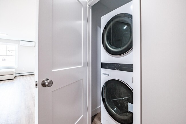 Enjoy the convenience of a full-size washer and dryer included in every apartment, making laundry day simple and hassle-free. - Windham Village Apartments