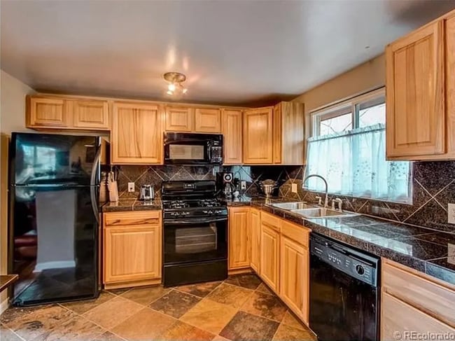 Very spacious kitchen with granite countertops, bar with seating facing living room - 2244 N Franklin St