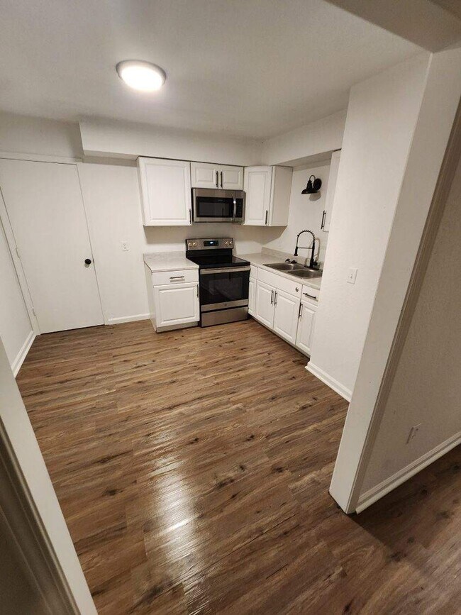 Kitchen area. New stainless refrigerator will be on the right wall - 407 S Forest Ave