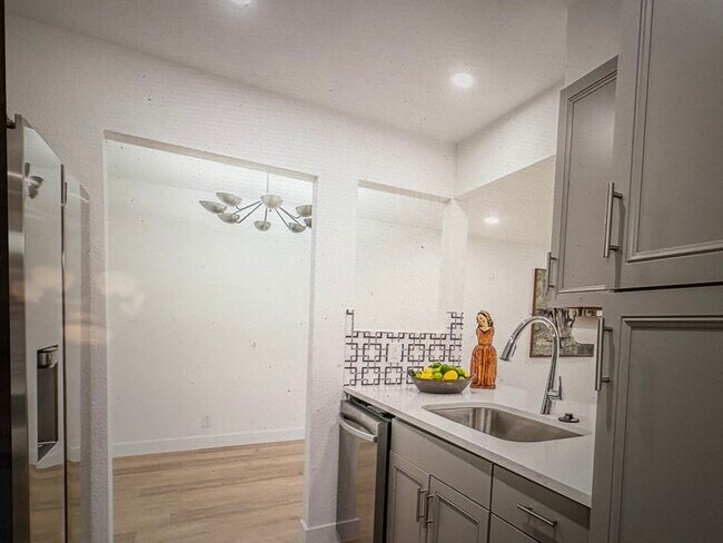 Kitchen into dining room - 4851 Cedar Springs Rd