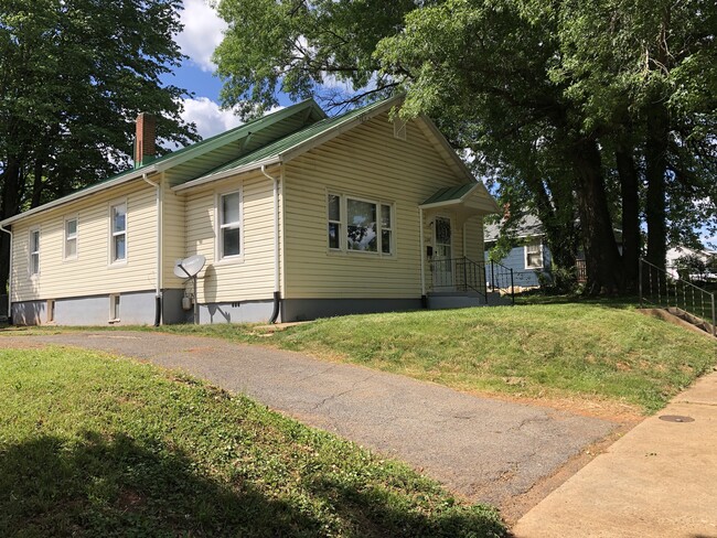 Off-Street parking with driveway for 4+ cars. - 2205 Mayflower Dr