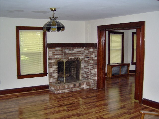 Parlor with fireplace - 77 Old Highway 28