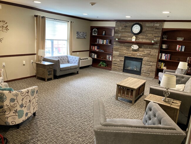 Fireplace Lounge/Library - Buckley Square Senior Apartments