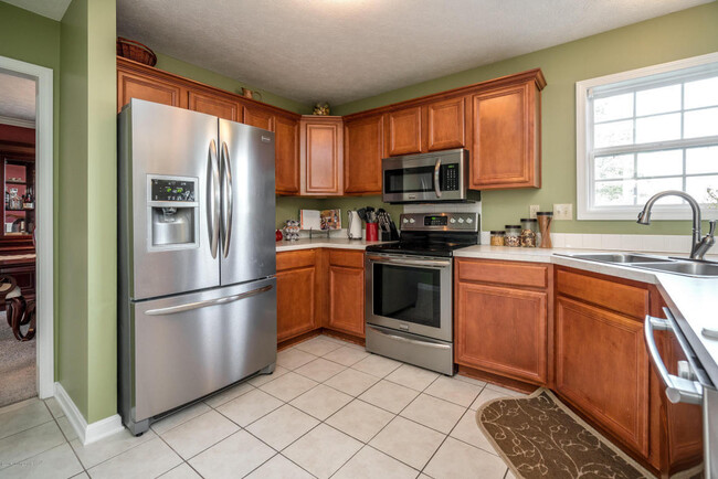 Kitchen with stainless steel appliances - 5608 Merribrook Ln