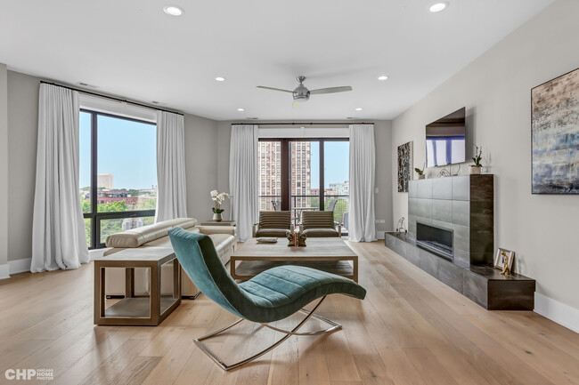 Living room with gas fireplace. - 1157 W Erie St