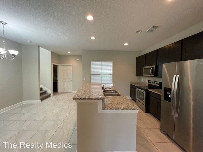 Building Photo - 3 br, 2.5 bath House - 8452 Magnificent Lane