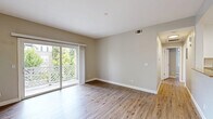 This 780 square foot single-story home in Napa, California offers a blend of comfort and functionality. The property features two bedrooms, including a spacious primary bedroom of 240 square feet. The open concept design combines the kitchen and living room, creating a versatile space for daily living and entertaining.

Throughout the home, beautiful hardwood floors add warmth and character, while neutral-toned walls provide a blank canvas for personalization. Large windows and sliding glass doors flood the rooms with natural light, offering views of the surrounding greenery and access to outdoor spaces.

The kitchen boasts modern stainless steel appliances, white cabinetry, and granite countertops, creating a sleek and efficient cooking area. A ceiling fan in one of the bedrooms provides additional comfort during warmer months.

The property's layout includes a hallway for easy navigation between rooms and a closet for added storage. The bathroom, though not explicitly mentioned, likely features updated fixtures to match the home's modern aesthetic.

This Napa residence combines contemporary updates with a practical layout, making it an ideal space for those seeking a turnkey property in California's renowned wine country.