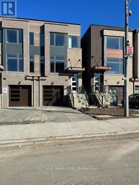 Photo du bâtiment - 33 Wild Rose Gardens