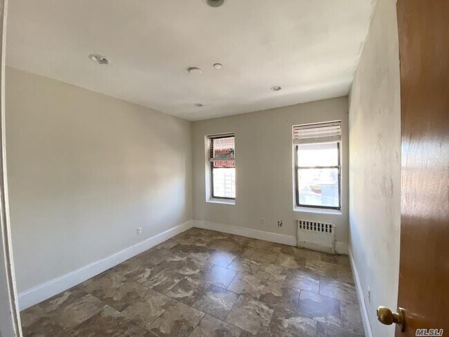 Building Photo - 32-50-50 104th St