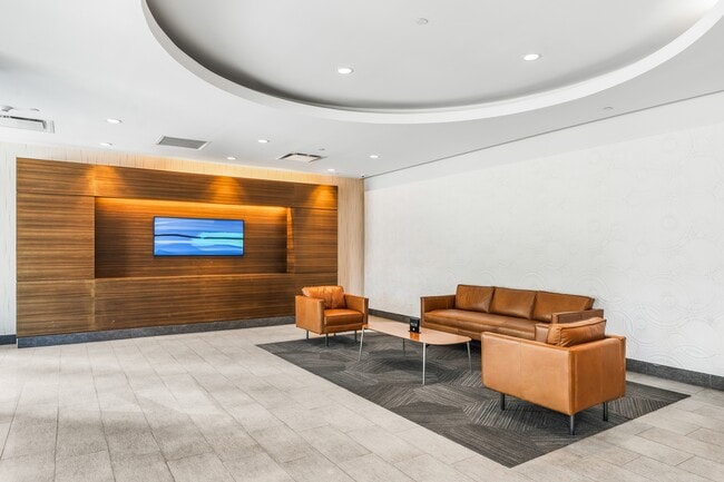 Welcome home to an elegant lobby that blends modern design with timeless sophistication - Newport Rentals