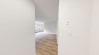 Located at 30-34 St Dennis Dr in Toronto's Don Mills neighbourhood, this 2-bedroom, 1-bathroom unit offers a functional and well-organized layout across a single floor. The interior is characterized by warm light wood laminate flooring and crisp white walls that create a clean, bright atmosphere throughout.

The living room is a generous open space with a baseboard radiator and recessed lighting, providing a welcoming area for relaxation or entertaining. It connects seamlessly to the hallway and the rest of the unit. The kitchen features dark granite-style countertops, white cabinetry, and a stainless steel refrigerator, offering a practical workspace for everyday living.

Both bedrooms are well-proportioned and filled with natural light from large windows that frame views of surrounding greenery and the neighbourhood streetscape. Each room includes closet space — one bedroom features a double closet, while the primary bedroom offers a built-in closet with ample storage. Radiator heating is present in each bedroom.

The bathroom is finished with large-format white tiles and includes a full soaker tub with an overhead shower and chrome fixtures, maintaining the unit's clean, minimalist aesthetic.

A connecting hallway ties all rooms together efficiently, contributing to the unit's practical flow and livability.
