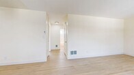 Located at 3634 Spencer St in Torrance, CA, this single-floor 2-bedroom, 1-bathroom home offers a well-organized layout with a clean, neutral aesthetic throughout. The living room is a bright, welcoming space featuring light wood-tone flooring and a large floor-to-ceiling window dressed with vertical blinds, allowing abundant natural light and outdoor views to fill the room. The kitchen is efficiently designed in a U-shaped layout with white cabinetry, white countertops, a stainless steel sink, and a white range. A window above the sink brings in additional natural light, and the wood-tone flooring continues seamlessly from the living area. The primary bedroom offers a comfortable footprint with soft carpeting, a wide sliding-door closet, and a ceiling fan. The second bedroom is similarly appointed with plush carpet, a sliding-door closet, and a window fitted with horizontal blinds for natural light and privacy. Both bedrooms maintain a calm, neutral palette. The full bathroom features a tub-shower combination with built-in shelving, clean white finishes, and a window for ventilation. Throughout the home, light walls and consistent flooring choices create a cohesive, bright, and functional living environment.