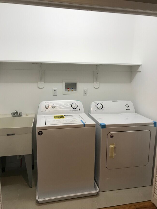 In-unit laundry room with washer, dryer, and laundry tub sink - 1407 88th St