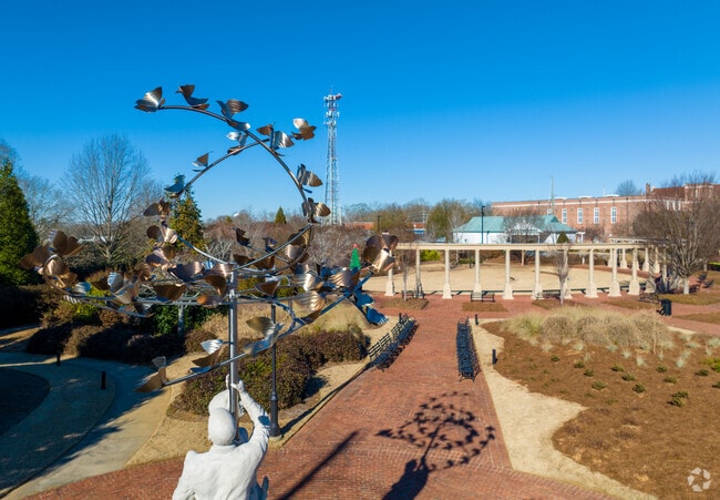 Uniquely crafted artwork blows in the wind at Newnan's Greenville Street Park.