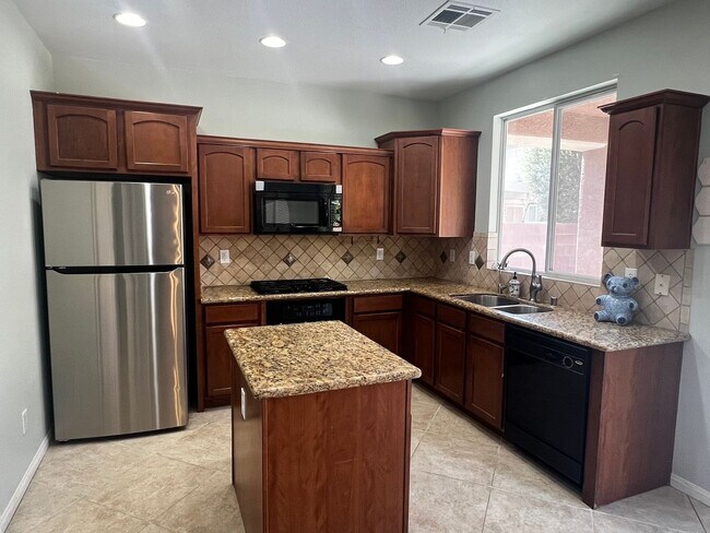 Building Photo - Spacious 4-Bedroom Mountains Edge Home with Downstairs Suite, Balcony & Covered Patio
