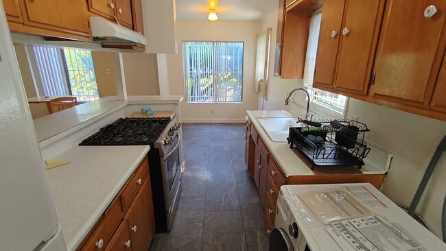 Kitchen from backyard entrance - 2471 Riverside Pl