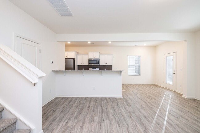 Building Photo - NEW 3BD Townhome Convenient to Hwy 74/ Min...