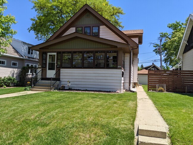 Sidewalk leads to back patio and entrance to upper unit - 1612 S 77th St