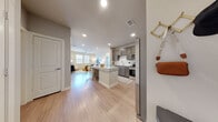 This thoughtfully designed 2-bedroom, 2-bathroom residence offers a comfortable and modern living experience across a single floor. The open-concept layout seamlessly connects the kitchen, dining, and living areas, creating a welcoming and functional central space. Light wood-style flooring runs throughout, enhancing the bright, airy feel of the home.

The kitchen is a standout feature, boasting rich dark-toned cabinetry, granite countertops, a classic subway tile backsplash, and a full suite of stainless steel appliances. A large center island with bar seating provides additional prep space and a casual dining option. The adjacent living area is generously sized, with a ceiling fan and ample natural light.

Both bedrooms are well-proportioned, each featuring ceiling fans, light-toned walls, and windows that invite natural light and outdoor views. The primary bedroom includes a dedicated closet with built-in wire shelving systems for organized storage. A second closet provides additional storage convenience.

The bathrooms are finished with dark cabinetry, granite countertops, and subway-tiled tub-shower combinations, maintaining a consistent design aesthetic throughout the home. Clean lines, neutral tones, and quality finishes define the overall ambiance of this modern, move-in-ready residence.
