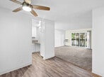 Located at 998 Meridian Ave in San Jose, California, this one-bedroom, two-bathroom apartment offers a well-organized single-floor layout designed for comfortable everyday living. The kitchen is equipped with granite-style countertops, white cabinetry, stainless steel appliances including a refrigerator and range, and an under-cabinet range hood — providing ample workspace and storage. The living room features wall-to-wall carpeting, a baseboard heating system, and a sliding glass door that opens to a private balcony with tree-lined views, filling the space with natural light. The bedroom is a comfortable size, also carpeted, with a large window that brings in additional natural light and outdoor views, complemented by a wall-mounted HVAC unit. A dedicated closet provides practical storage. The two bathrooms are finished with wood-look flooring, granite-style countertops, white cabinetry, and tub-shower combinations with tiled surrounds. A built-in wall heater in one bathroom adds a convenient touch. Throughout the unit, textured ceilings and neutral tones create a clean, cohesive aesthetic. This apartment combines practical features with a functional layout in a well-situated San Jose location.