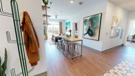 Located at 1231 Third Ave S in Birmingham, Alabama, this 4-bedroom unit offers a thoughtfully designed single-floor layout ideal for shared living. The open-concept common area seamlessly connects the living and dining spaces, finished with warm wood-tone flooring and bright white walls that serve as a backdrop for bold, colorful artwork. A high-top dining table with bar stools anchors the dining zone, while the living room features a sliding glass door that opens to a private balcony with views of the surrounding cityscape, filling the space with generous natural light.

The kitchen is well-equipped with stainless steel appliances—including a refrigerator, range, microwave, and dishwasher—complemented by light wood cabinetry and granite-style countertops, providing ample storage and prep space.

Each of the four bedrooms offers a comfortable, private retreat with carpeted floors, a dedicated closet, and a window for natural light. The bedrooms are well-suited for both rest and study, with space to accommodate a desk and workspace.

Bathrooms feature wood-tone cabinetry with granite countertops, large mirrors, and wood-look flooring, maintaining a consistent, clean aesthetic throughout. The overall ambiance of the unit is modern and vibrant, balancing functional shared spaces with private, well-defined individual areas.